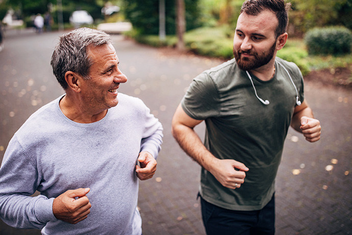 decorative image of two men running side-by-side