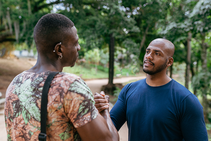 decorative image, two men handshaking outside
