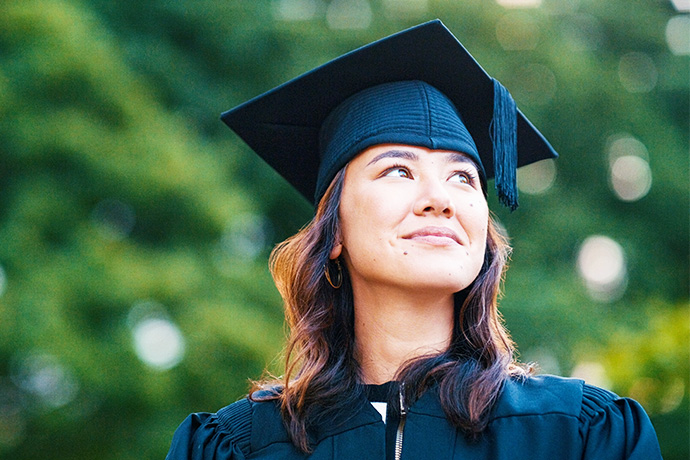 decorative image of a women in a graduation gown