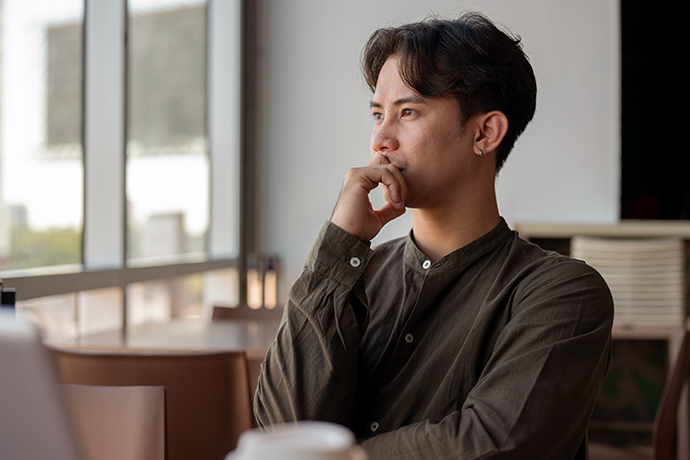decorative image, man looking distressed in thought
