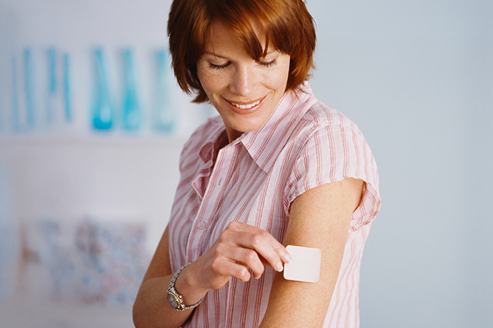 decorative image of a women putting a patch on her arm