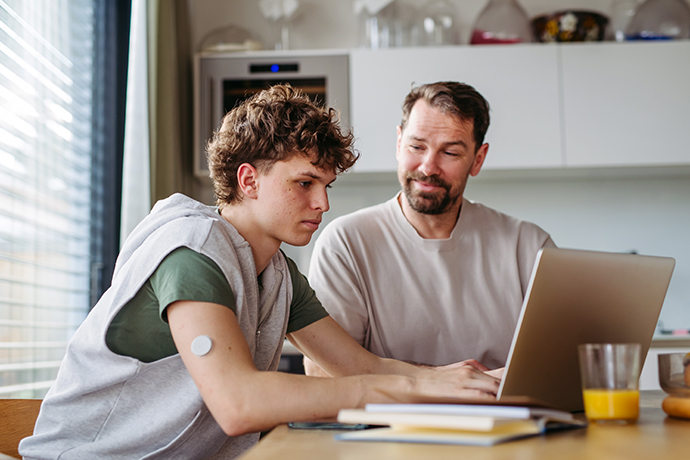 decorative image, college tutor with student