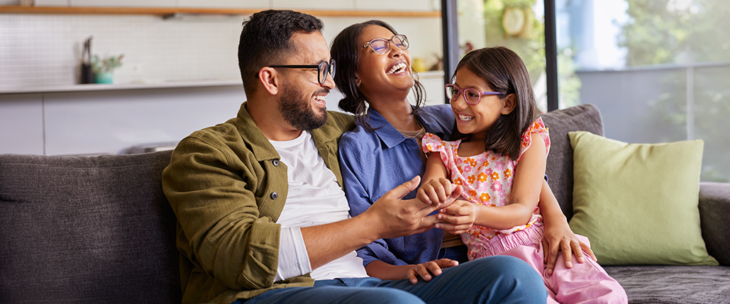 family sitting together on a couch