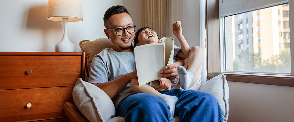 dad and son reading a book