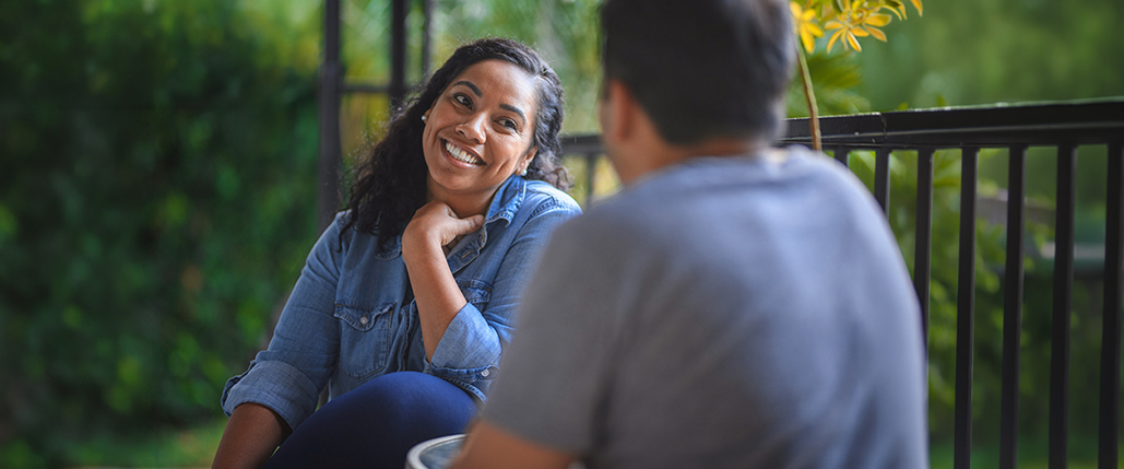 decorative image, two people sitting outside talking